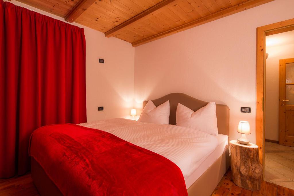 Postel nebo postele na pokoji v ubytování Stelvio Residence