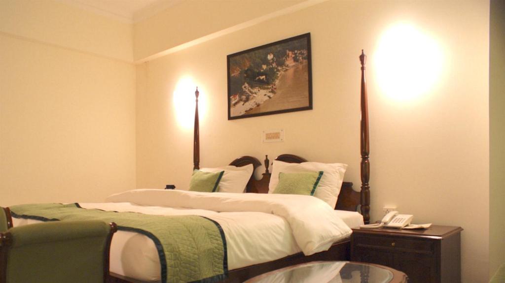 Postel nebo postele na pokoji v ubytování Hotel Alpana