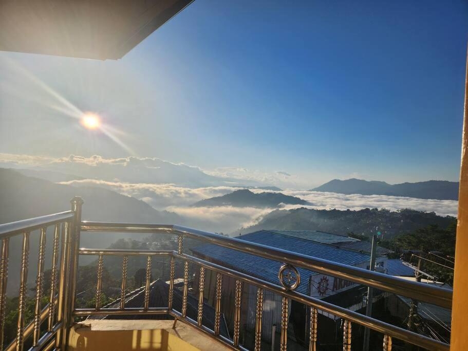 a balcony with a view of the mountains at Ina Puring's House in Itogon