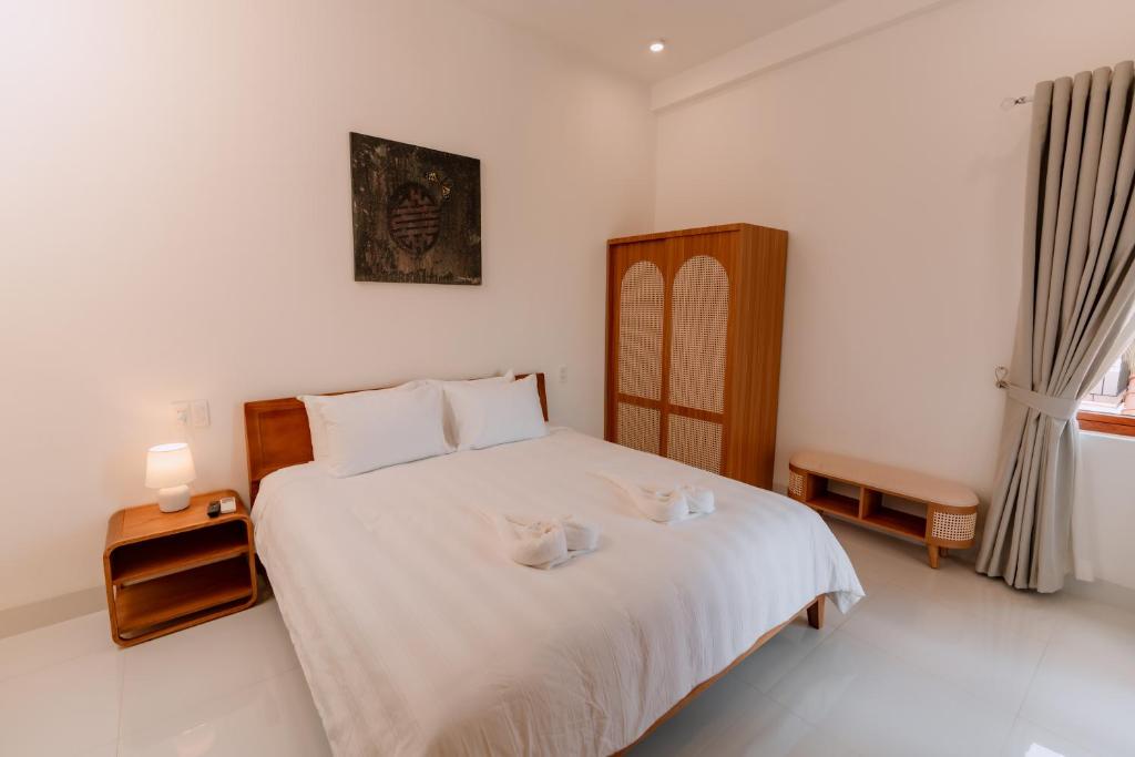Giường trong phòng chung tại Hue River Side Villa