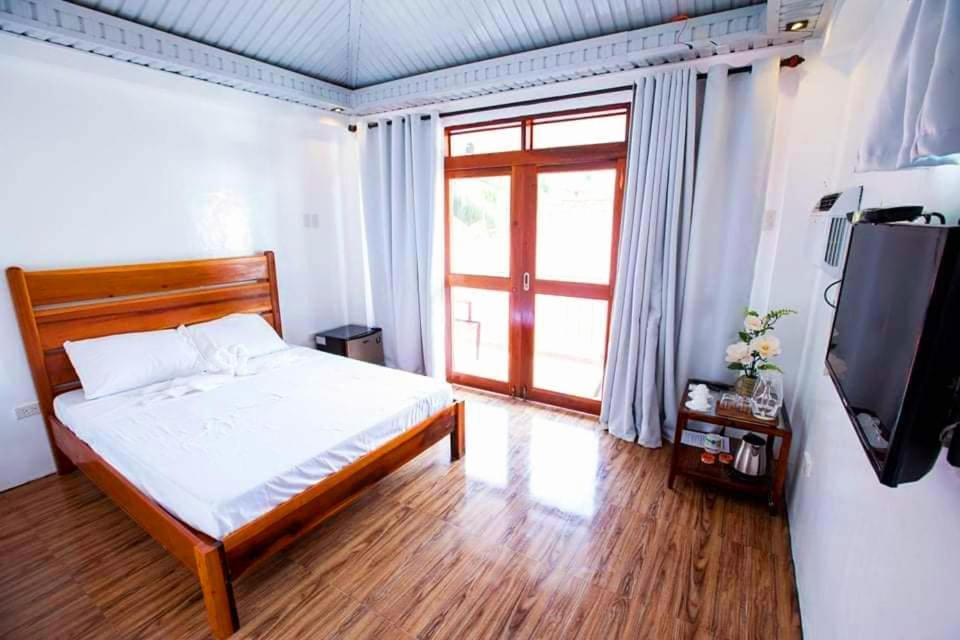 Postel nebo postele na pokoji v ubytování Siargao Home Sweet Home
