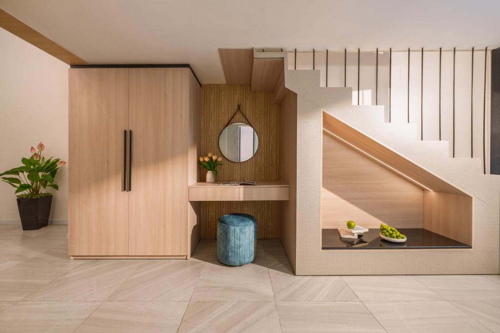 A styled hotel living area beside a staircase.