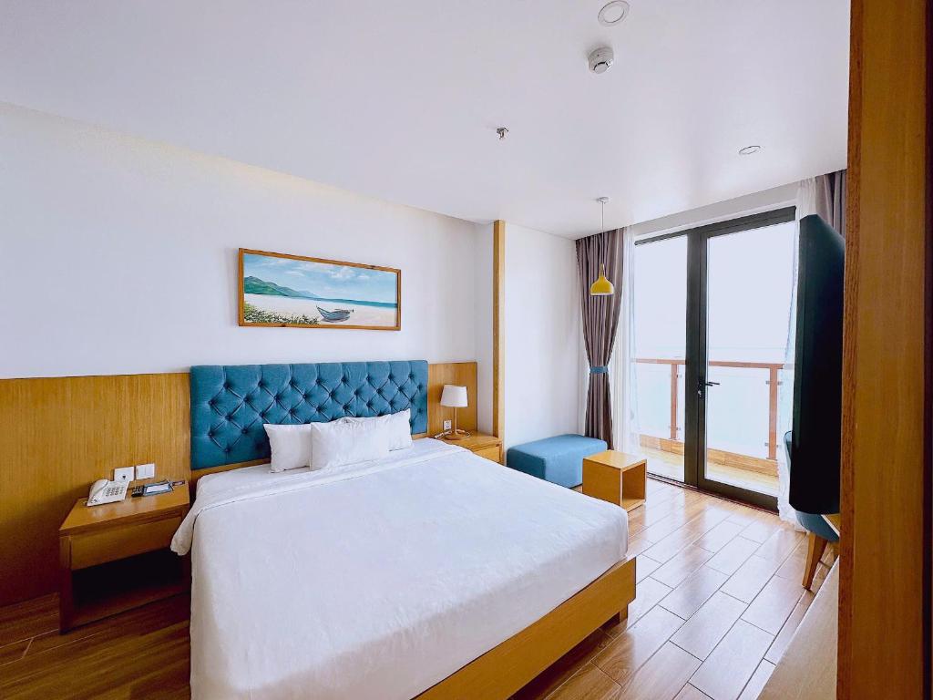 Postel nebo postele na pokoji v ubytování Seashore Hotel & Apartment