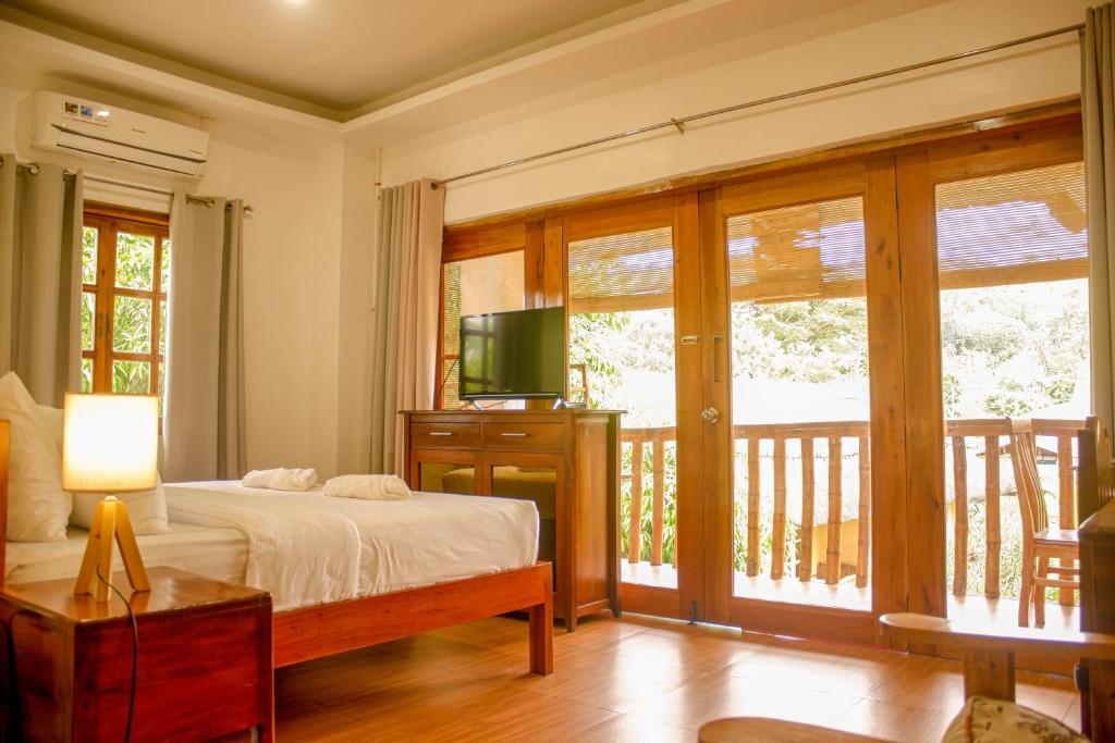 Postel nebo postele na pokoji v ubytování Wilcon Guesthouse Catulayan