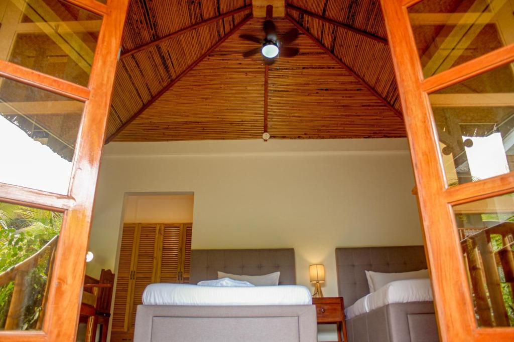 Postel nebo postele na pokoji v ubytování Wilcon Guesthouse Catulayan