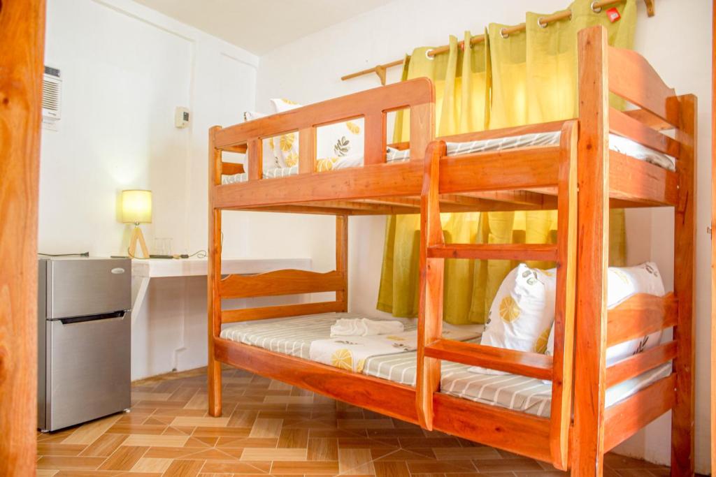 Postel nebo postele na pokoji v ubytování Wilcon Guesthouse Catulayan