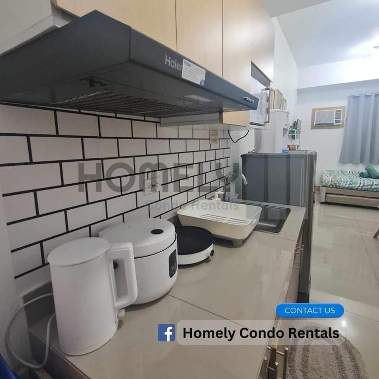 Kuchyň nebo kuchyňský kout v ubytování Homely - SMDC Green 2 Residences, Dasmarinas City