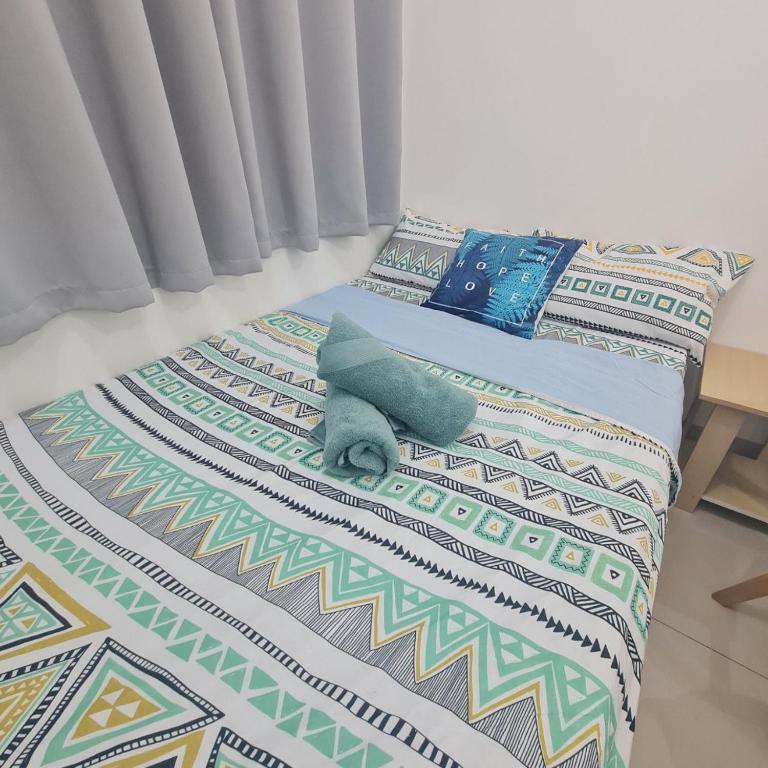 Postel nebo postele na pokoji v ubytování Homely - SMDC Green 2 Residences, Dasmarinas City