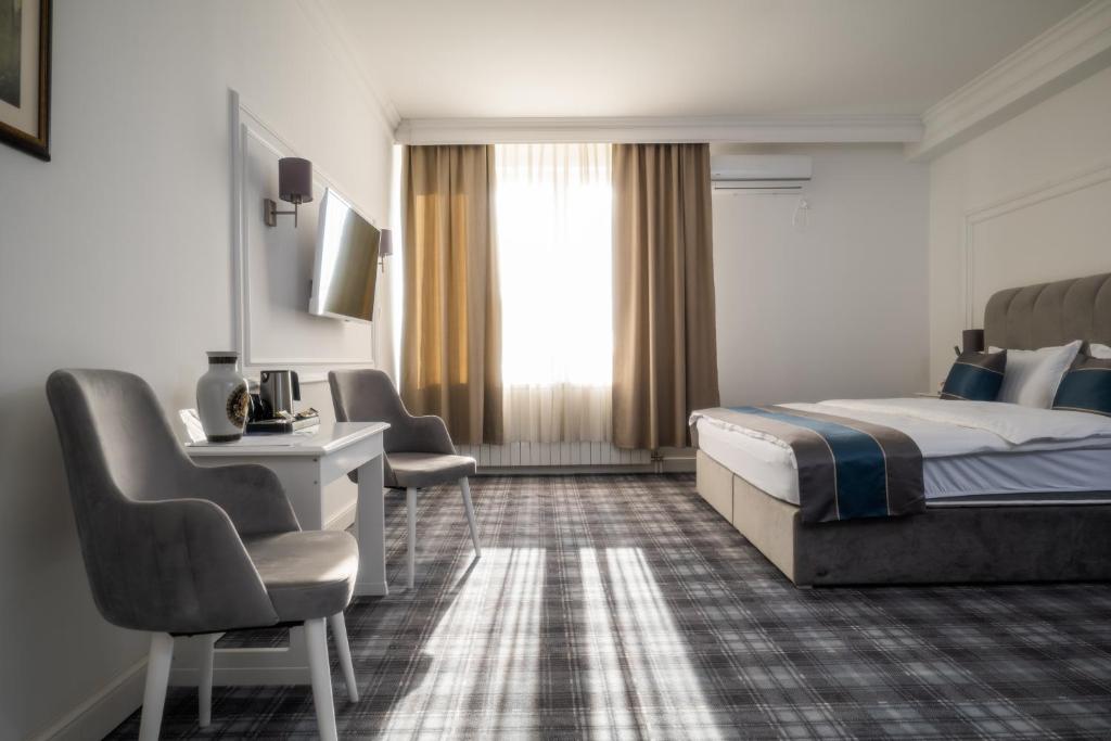 Letto o letti in una camera di Hotel Mio City