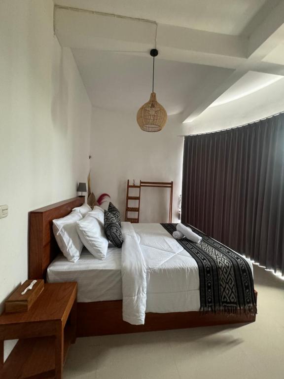 Postel nebo postele na pokoji v ubytování TUGU Bali glamping