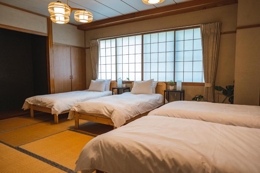 Postel nebo postele na pokoji v ubytování Butter Hotel