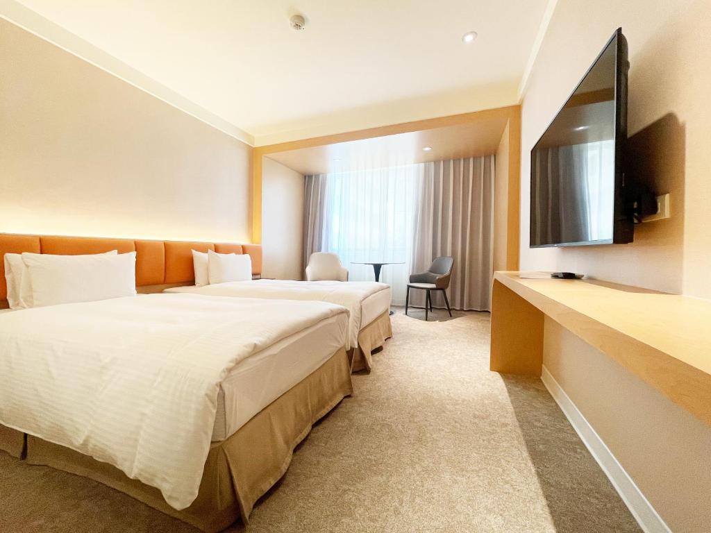 TV a/nebo společenská místnost v ubytování Hotel Tainan