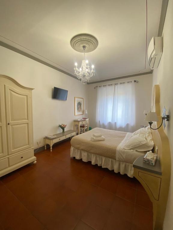 Posteľ alebo postele v izbe v ubytovaní Palazzo Mari suite & rooms b&b