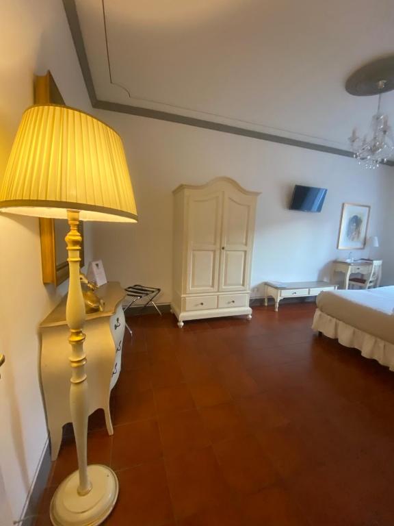 Posteľ alebo postele v izbe v ubytovaní Palazzo Mari suite & rooms b&b