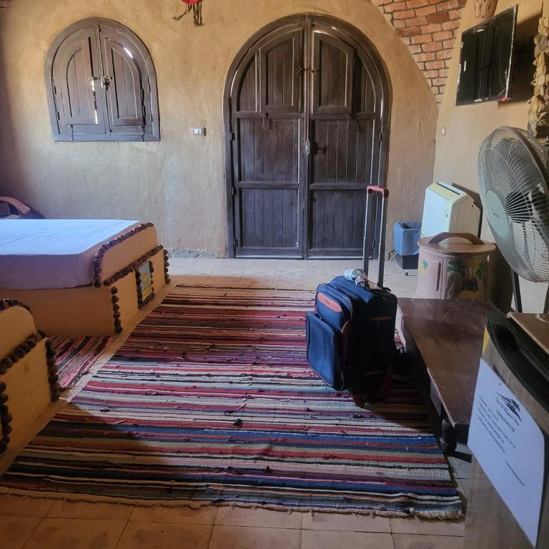 Postel nebo postele na pokoji v ubytování Qasr El Bagawat Hotel
