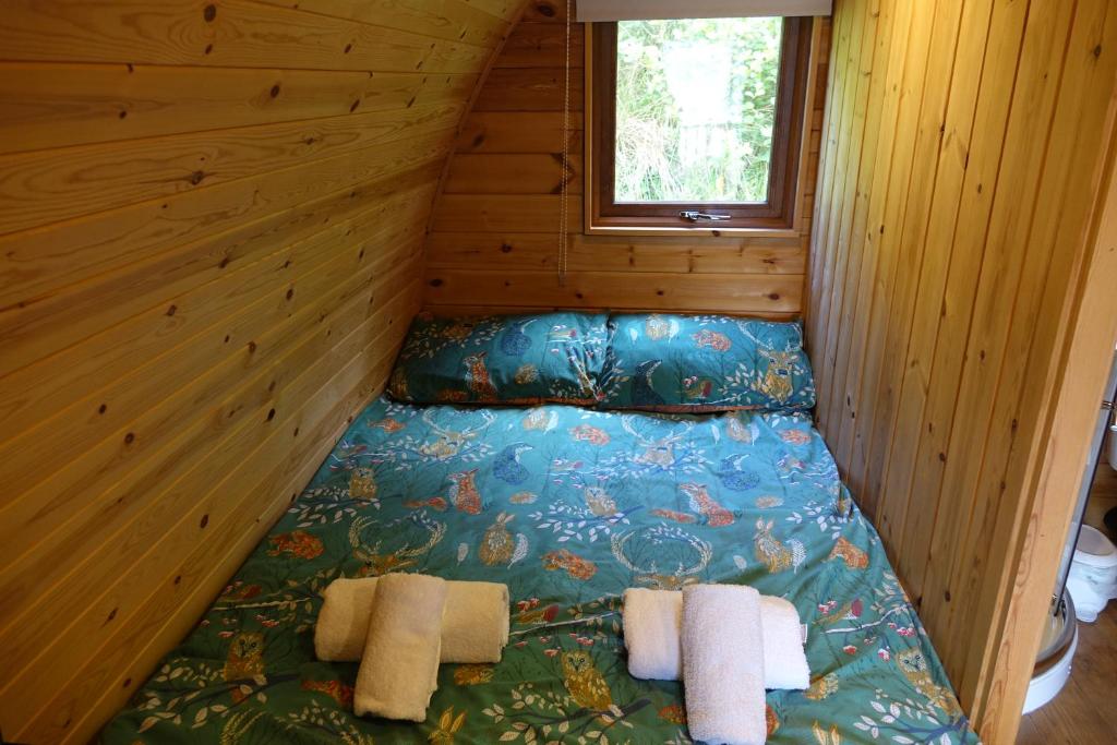 Postel nebo postele na pokoji v ubytování The Wee Lodge