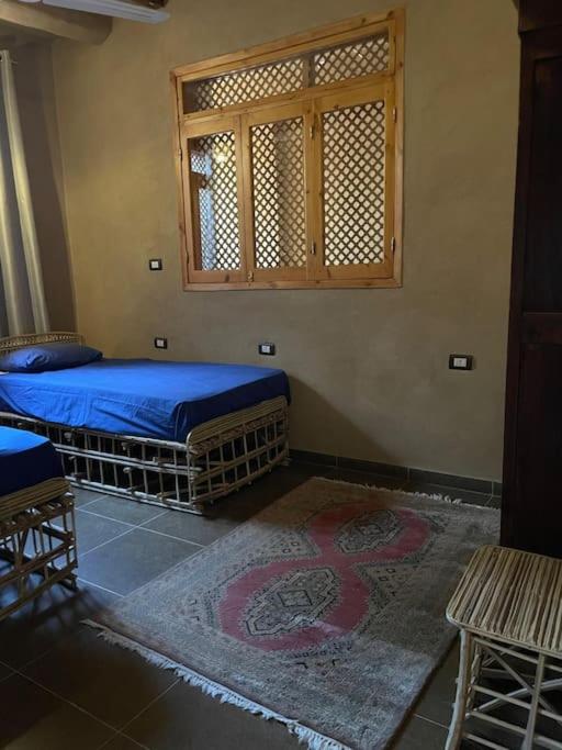 Postel nebo postele na pokoji v ubytování Ecolodge El Beit