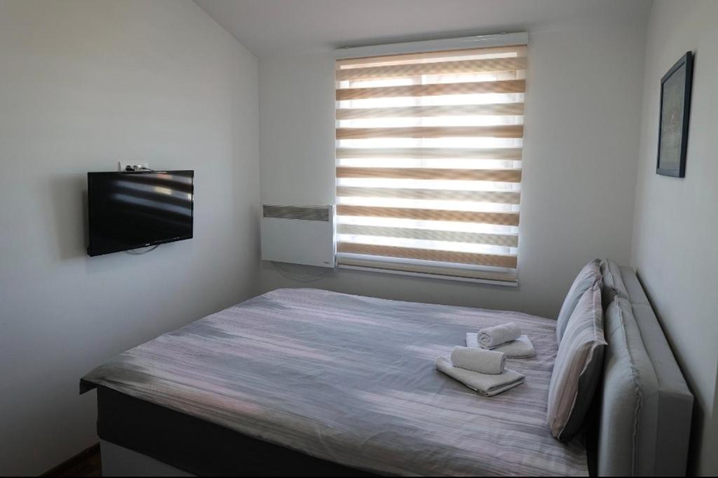 Postel nebo postele na pokoji v ubytování Apartman Petar