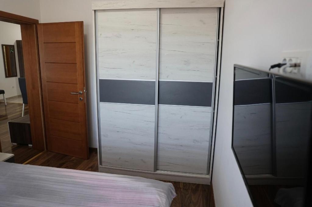 Postel nebo postele na pokoji v ubytování Apartman Petar
