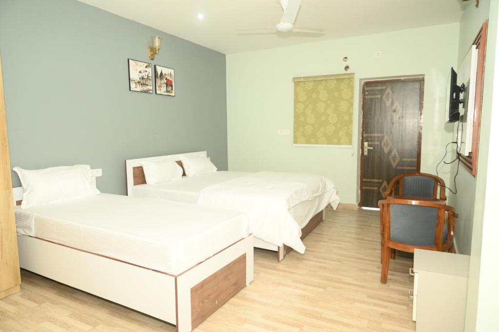 Postel nebo postele na pokoji v ubytování shangrila stay