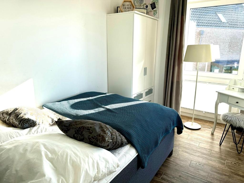 Postel nebo postele na pokoji v ubytování Küstenglück