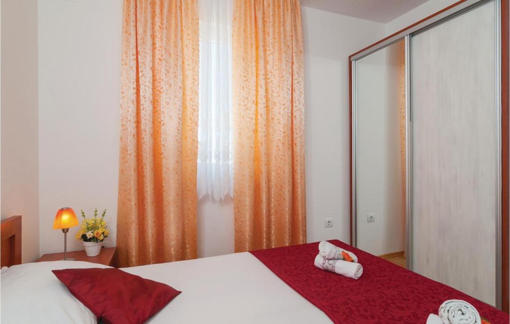 Postel nebo postele na pokoji v ubytování Apartment Supetar 43