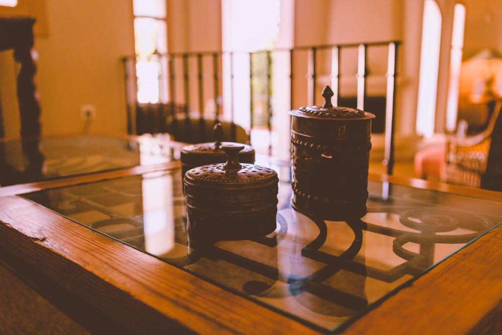 a group of candles sitting on top of a table at miKasa Agua Amarga & SPA in Agua Amarga