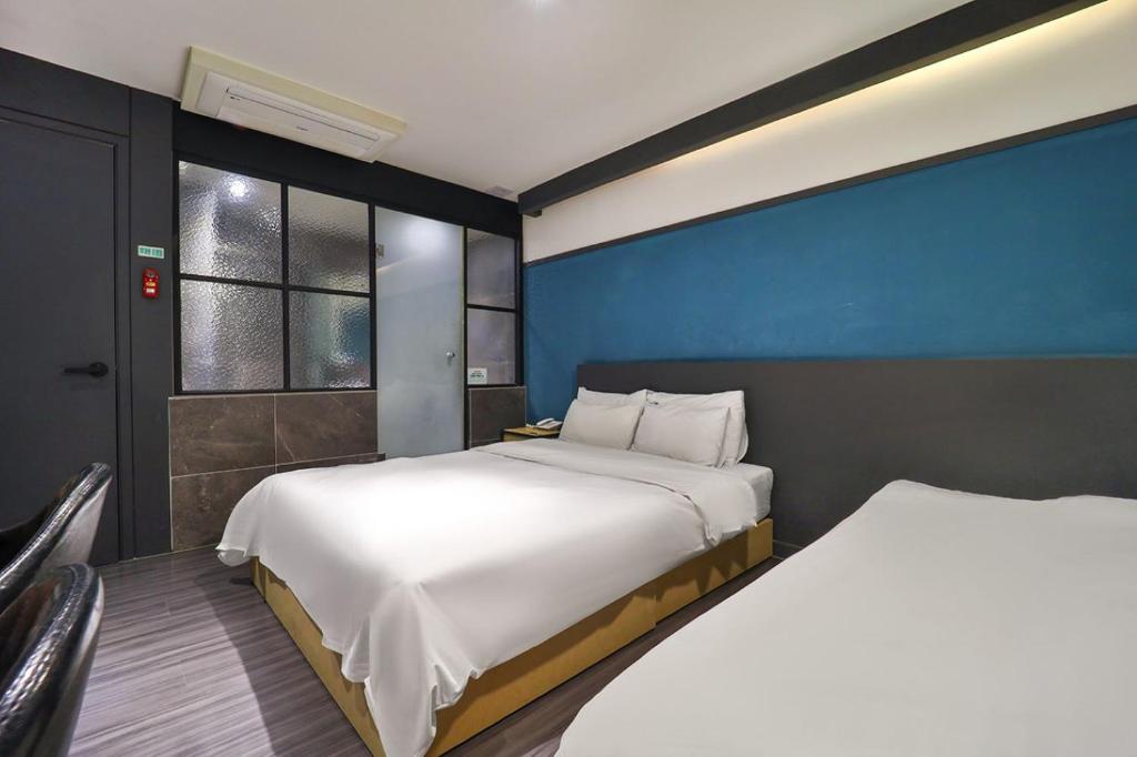 Postel nebo postele na pokoji v ubytování No 25 Hotel Yonghyun