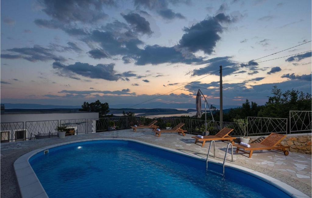 a swimming pool on the roof of a house at Villa Ancora in Jadranovo