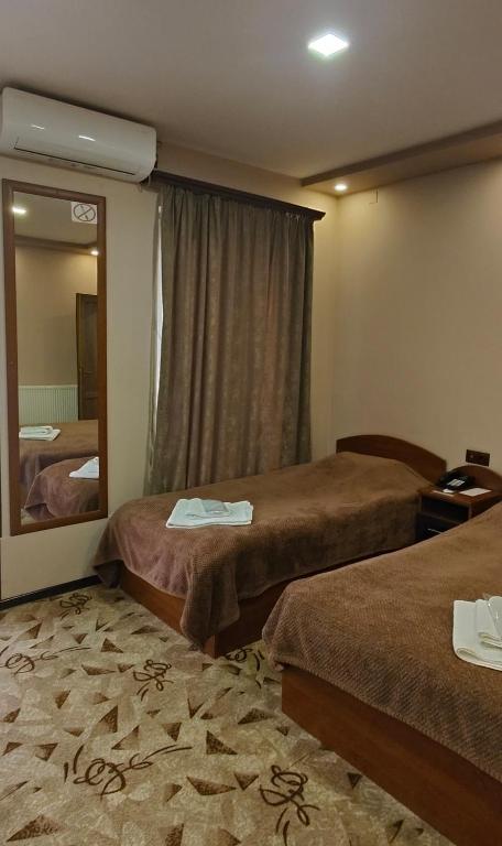 Postel nebo postele na pokoji v ubytování Areg Hotel