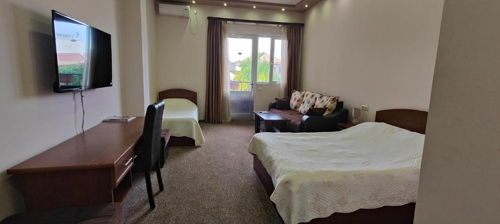 TV a/nebo společenská místnost v ubytování Areg Hotel