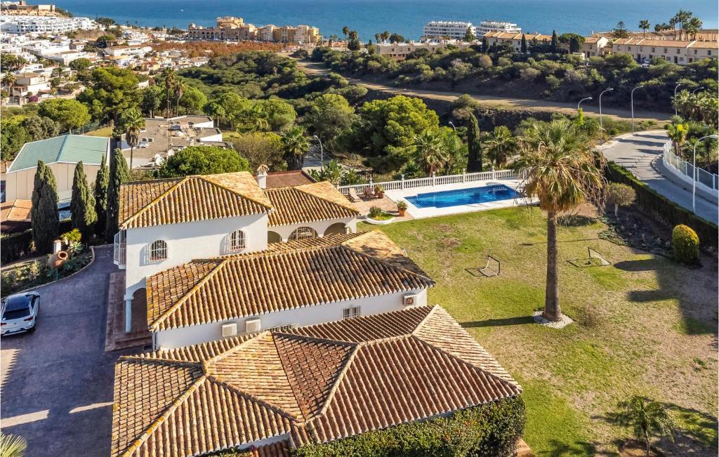 an aerial view of a house with a yard at Amazing Home In Las Lagunas De Mijas in Fuengirola