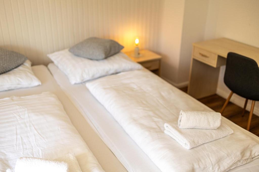 Postel nebo postele na pokoji v ubytování Visiet - Ferienwohnungen in Emden