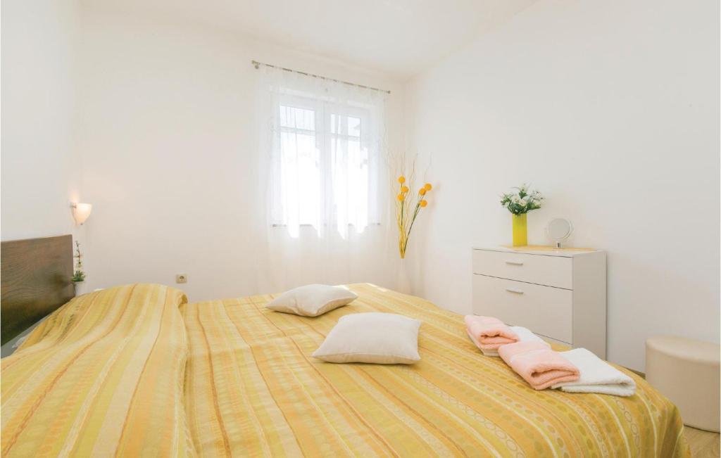 Łóżko lub łóżka w pokoju w obiekcie Apartment Labin Kapelica Iii
