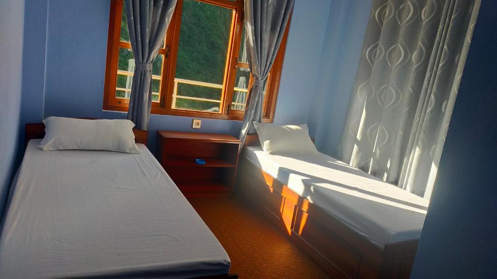 Postel nebo postele na pokoji v ubytování Hotel Garden Inn
