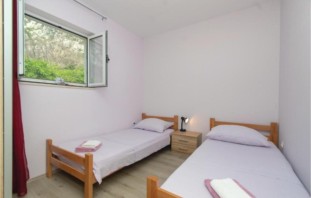 Posteľ alebo postele v izbe v ubytovaní Two-Bedroom Apartment In Trstenik
