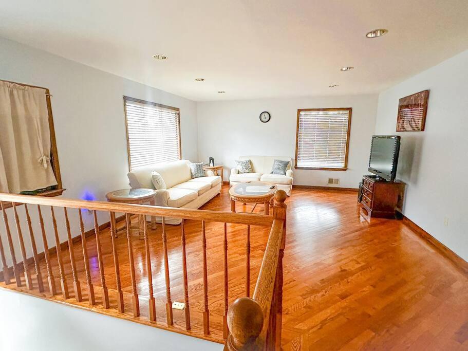 a living room with a couch and a tv at 2000 square feet of comfort and relaxation near NYC in South River