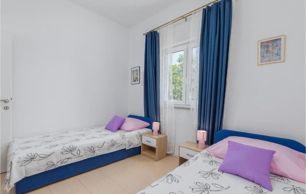 Postel nebo postele na pokoji v ubytování Two-Bedroom Holiday Home In Fazana