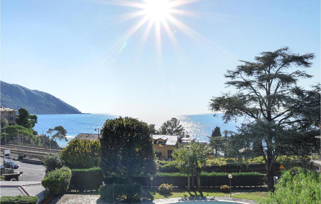 a view of a garden with the sun in the sky at Amazing Apartment In Recco With Kitchen in Recco
