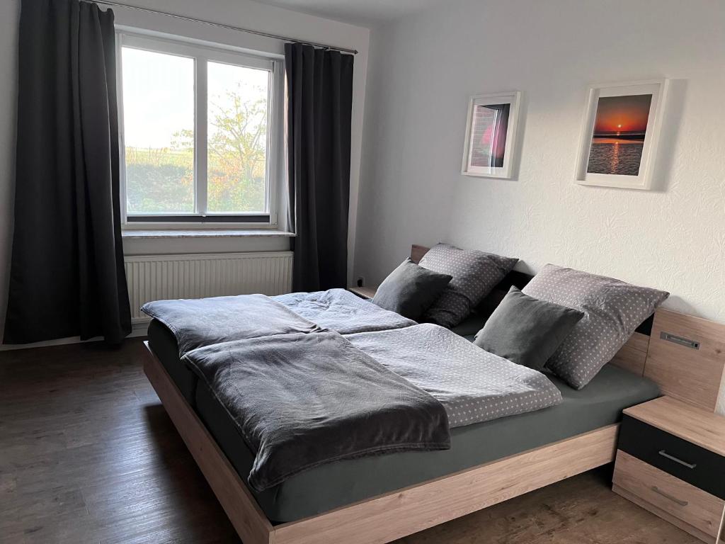 Postel nebo postele na pokoji v ubytování Ferienhaus Sonnendeich