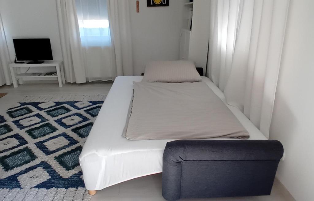 Postel nebo postele na pokoji v ubytování Kertész14 Apartman