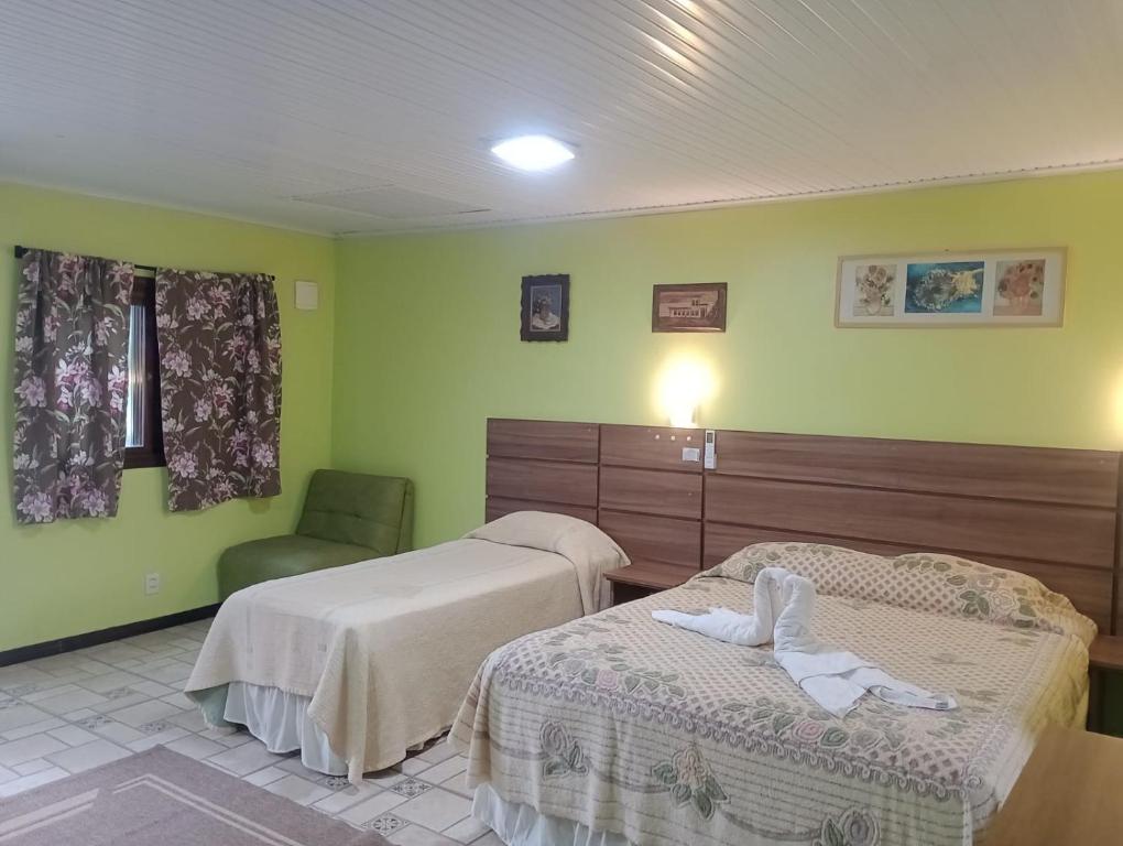 Postel nebo postele na pokoji v ubytování Refúgio familiar