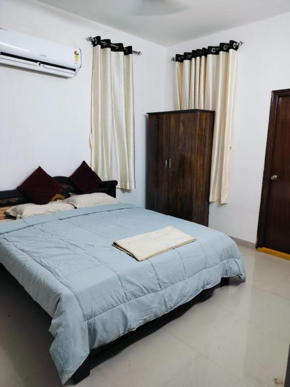 Postel nebo postele na pokoji v ubytování corporate Guest house