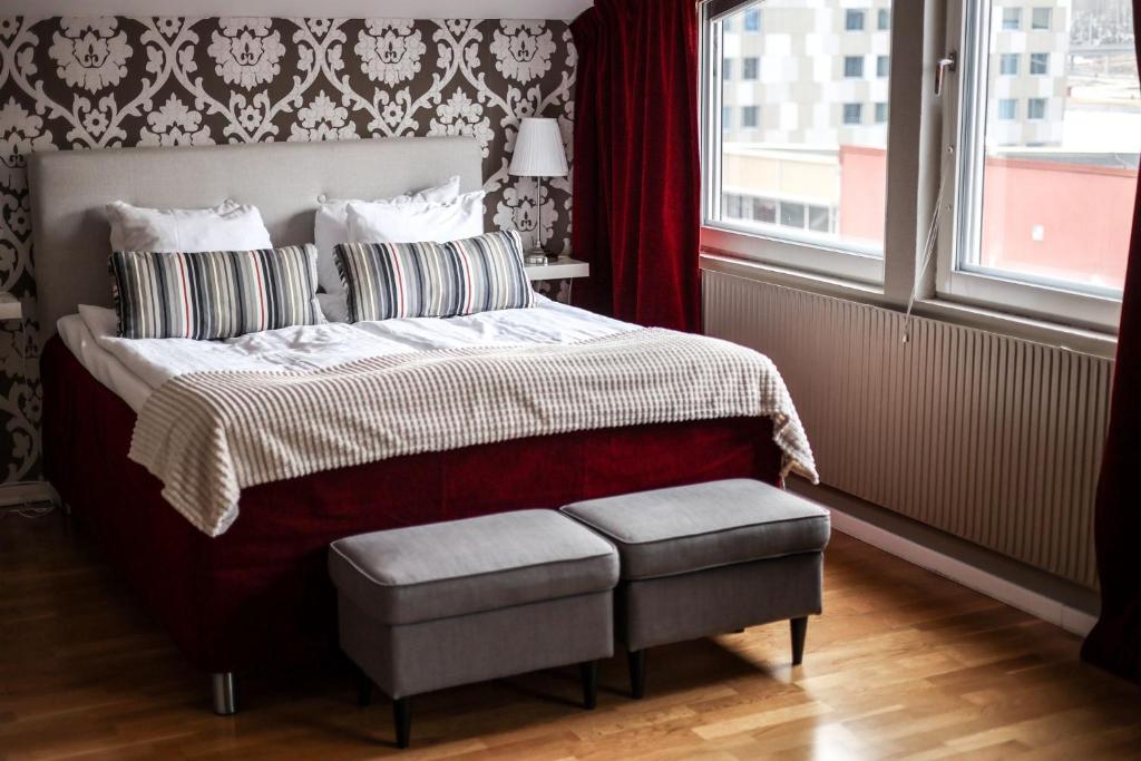 Postel nebo postele na pokoji v ubytování First Hotel Statt Örnsköldsvik