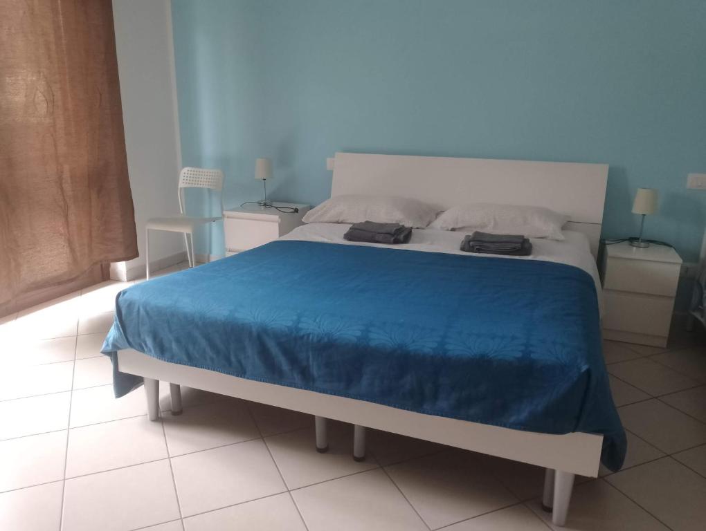 Łóżko lub łóżka w pokoju w obiekcie Appartamento La Bonifica