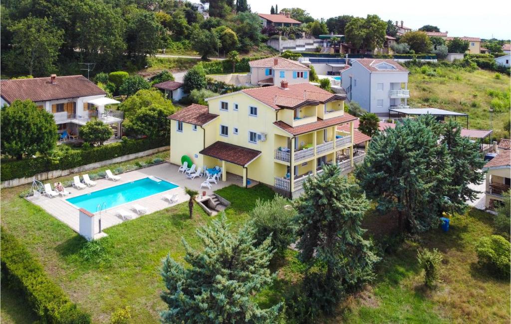an aerial view of a house with a swimming pool at Lovely Apartment In Porec With Wifi in Poreč