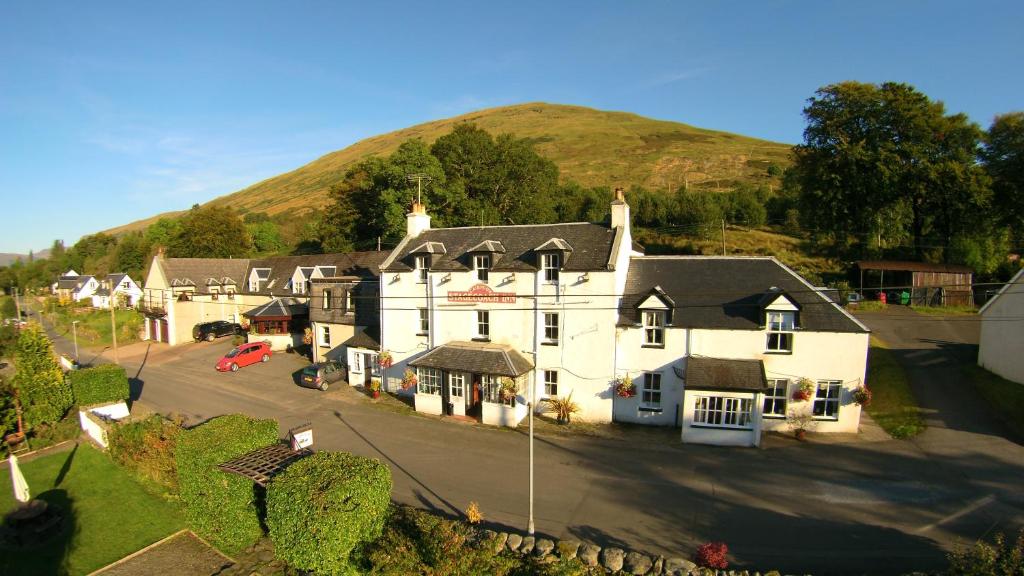 an aerial view of a house with a hill in the background at Cairndow Stagecoach Inn in Cairndow