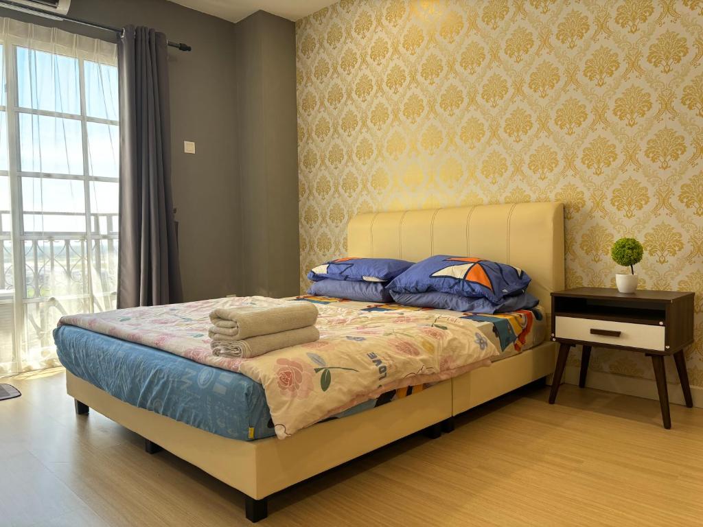 Postel nebo postele na pokoji v ubytování KF Homestay Premium Suite