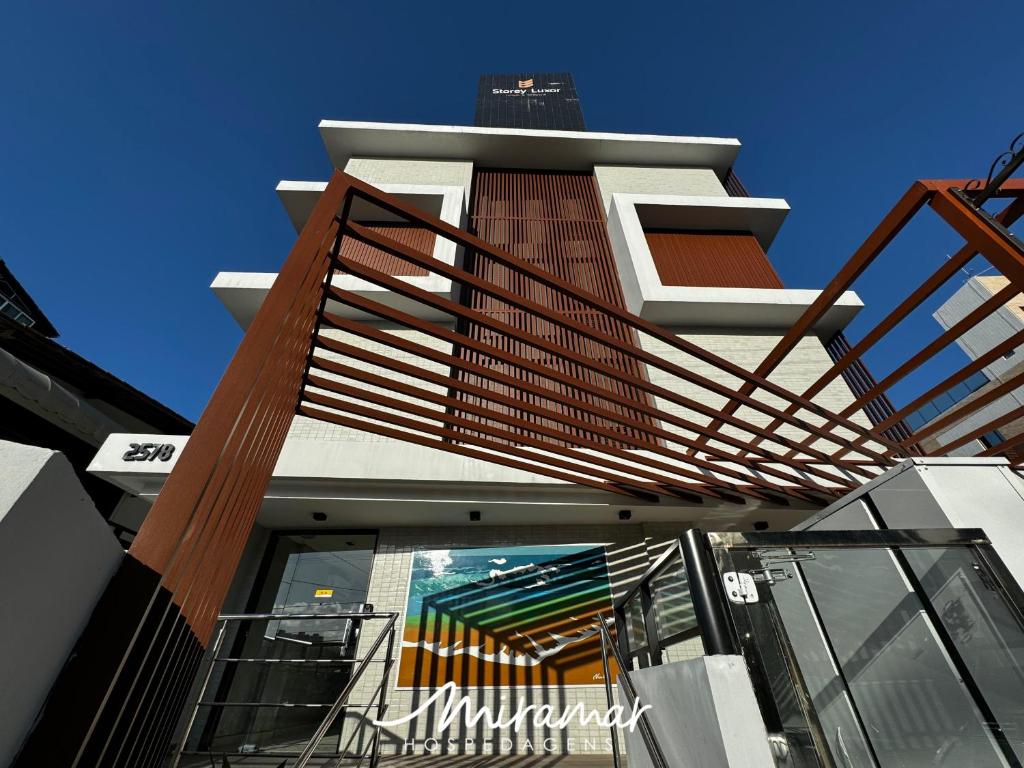 a building with a staircase on the side of it at Flat No Bessa com Varanda Gourmet in João Pessoa