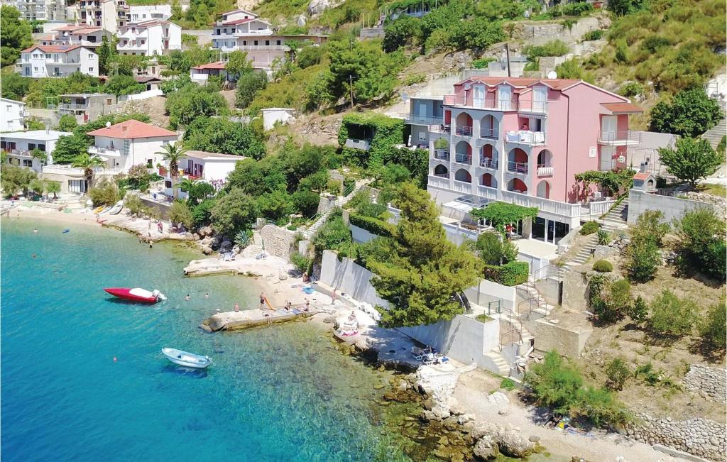 an aerial view of a beach with boats in the water at One-Bedroom Apartment In Stanici in Celina